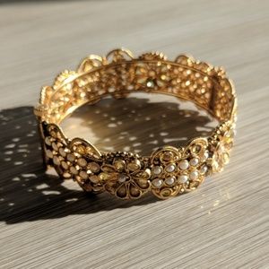 Intricate gold pearl and crystal cuff bracelet